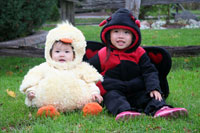 Photo of small children in Halloween costumes.