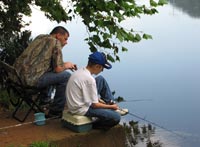 Photo of father and son fishing.