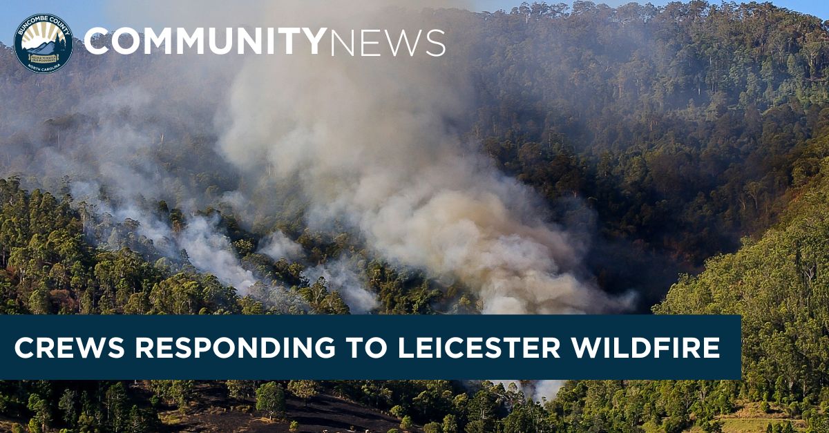 Image of smoke on the side of a mountain with superimposed text stating Crews Responding to Leicester Wildfire