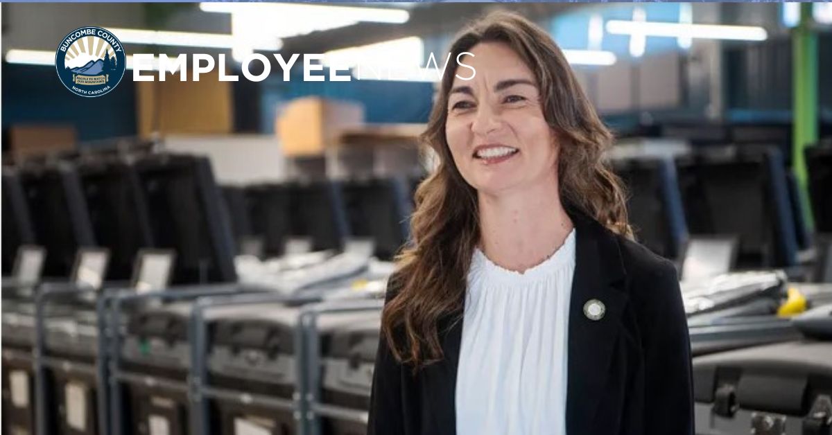 Corinne Duncan stands in front of election machines